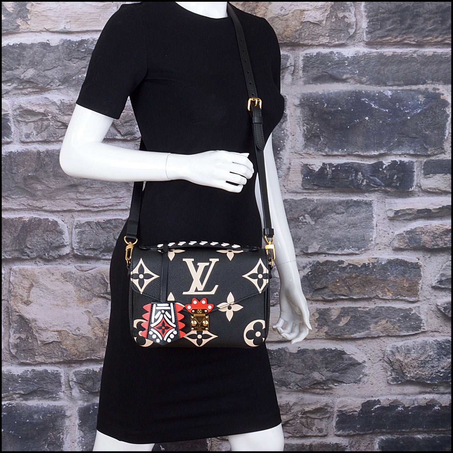 RDC14930 LOUIS VUITTON 2020 Black/Creme Empreinte Giant Monogram Crafty Pochette Metis